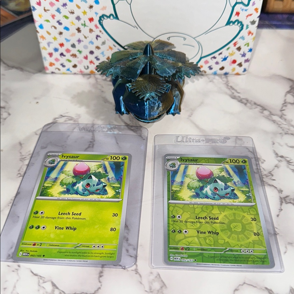3D print metallic multicolored Pokemon character Ivysaur and two 151 cards